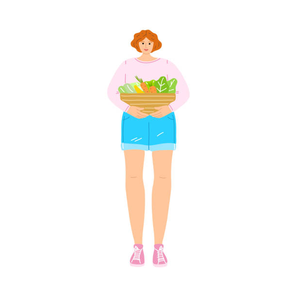 glücklich lächelnde vegetarische mädchen in einem rosa t-shirt mit einem korb mit frischem gemüse. vektor-illustration im cartoon-stil - woman happy eat stock-grafiken, -clipart, -cartoons und -symbole
