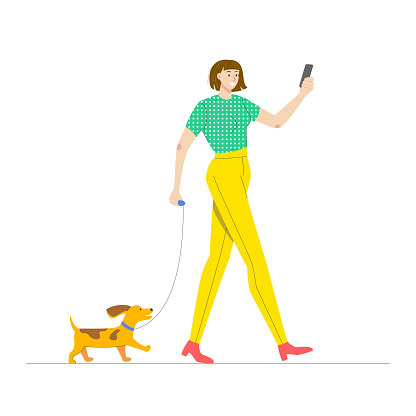 Happy woman walking her dog.
