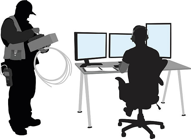 Hardware And Software A vector silhouette illustration of a technician installing cables for an it department.  A young man works on his computers while the technician takes notes. technology silhouettes stock illustrations