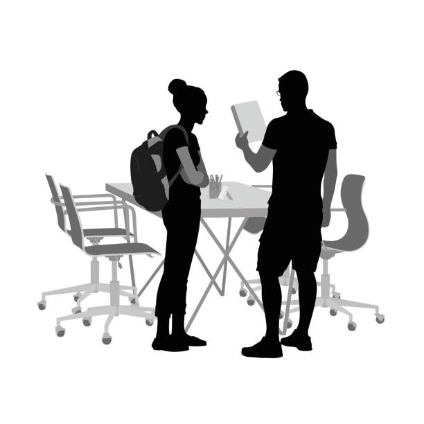Helping Peers A vector silhouette illustration of a male and female of student in a classroom where the young man is looking at a document.  A table with chairs pushed in is in the background. teacher silhouettes stock illustrations