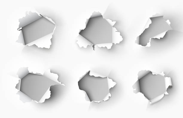 Holes torn in paper on white background Holes torn in paper on white background hole stock illustrations
