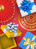 istock Holiday Background with Open Red Gift Box and Chinese Decorations 1351088957