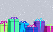 Rainbow Vibrant Wrapped Gift boxes and packages with snow background pattern.