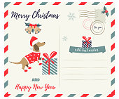 Christmas or New Year greeting postcard with holiday dachshund