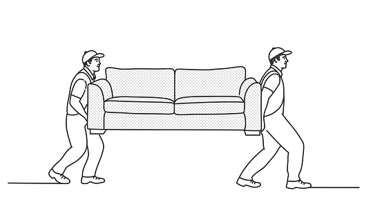 Home delivery of furniture. Workers carry a sofa.
