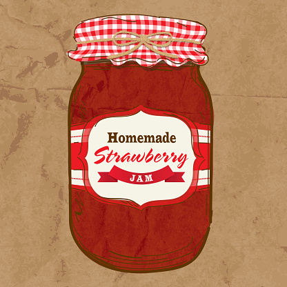 Homemade strawberry jam mason jar with checkered top