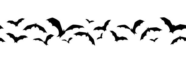 Horizontal seamless background with bats. Vector illustration. Vector horizontal seamless background with bats on a white background. bat stock illustrations