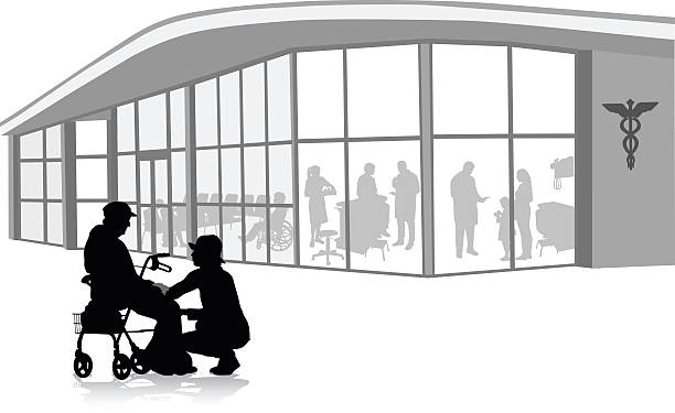 Hospice Caretaker A vector silhouette illustration of an elderly woman sitting on her walker with a young woman crouched beside her.  AThey are outside of a medical facility with patience and doctors inside. hospital silhouettes stock illustrations