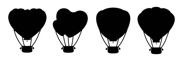 Hot air balloon black silhouette heart shape set Hot air balloon black silhouette set. Monochrome heart shape or circle. Cartoon Valentine day design air balloons collection. Festivals or wedding journey air transport. Vector Isolated illustration balloon silhouettes stock illustrations
