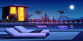 House and swimming pool with deck chairs and balls in water at night. Vector cartoon summer landscape with illuminated villa, basin on lawn, palms and moon in sky