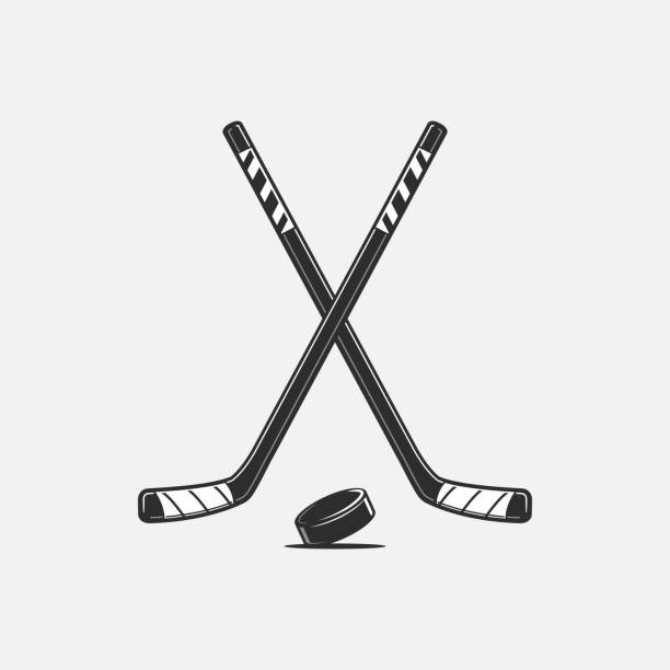 Ice Hockey Crossed hockey sticks and puck vector illustration hockey stick stock illustrations