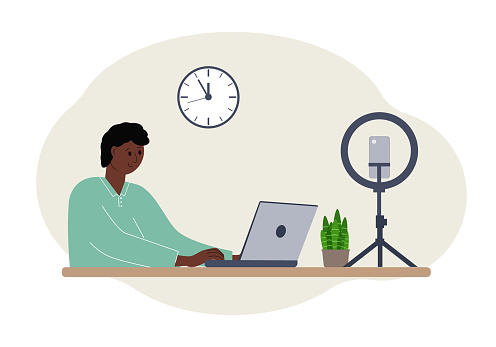 Illustration of a male blogger at the table with a laptop. Online filming of a training course or blog