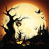 - halloween pumpkins with spooky trees and haunted castle