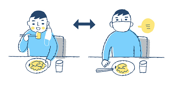 Infectious disease prevention: Men wearing masks and eating