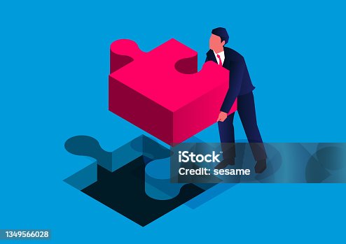 istock Isometric businessmen install the last piece of the team puzzle 1349566028