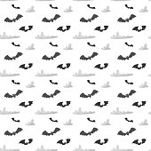 A seamless background pattern of flying bats that are perfect for the Halloween season.