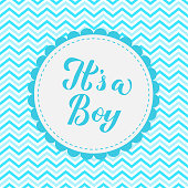It's a boy calligraphy lettering on blue chevron background. Gender reveal sign. Baby shower decorations. Vector template for invitation, greeting card, banner, typography poster, label, etc.