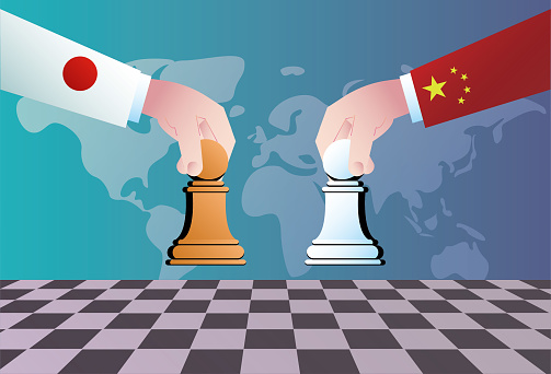 Japan and China play chess, and the two countries compete economically, trade and politically.