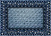 Jeans frame with sequin ornament and stitches on jeans background.