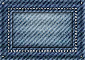 Jeans frame with spangles on jeans background.