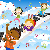 Multi-ethnic kids playing keyboard and piano concept.