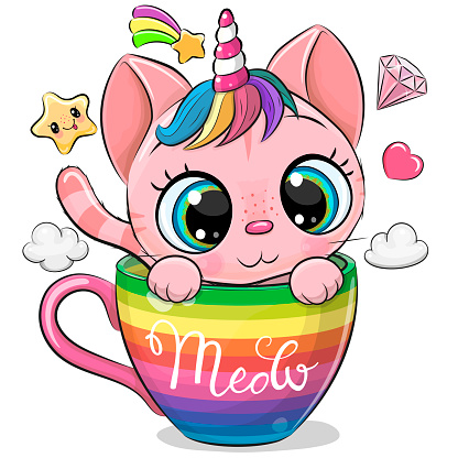 Kitten with the horn is sitting  in a cup