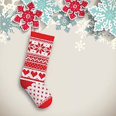 knitted christmas stocking with abstract snowflakes on beige background, vector illustration, eps 10 with transparency and gradient meshes