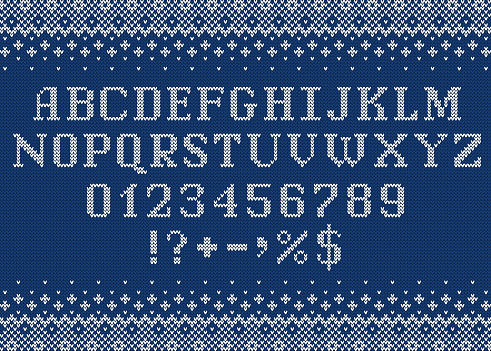 Sweater font. Knitted letters, numbers and symbols for Christmas,  New Year or winter season. Alphabet and scandinavian ornaments on blue knit background. Typeface vector design.