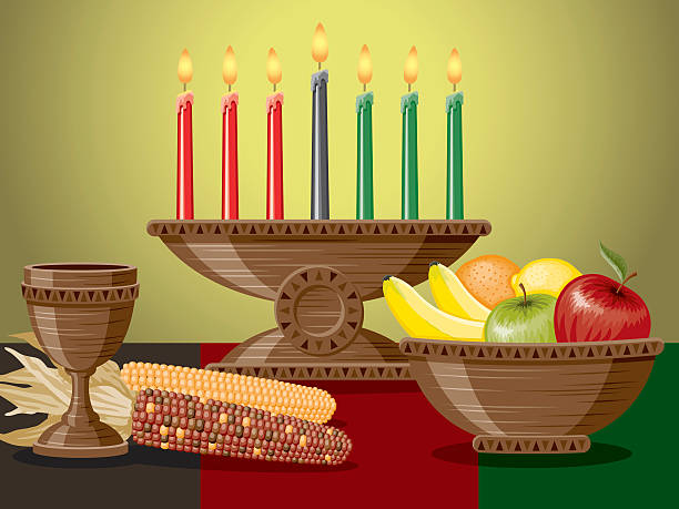 A typical table setting for Kwanzaa, with a Unity Cup, corn, fruit and candles (Mishumaa Saba) laid out on a red, black and green flag. Illustration is grouped and layered, and contains flat shapes with gradients on the candle flames and in the background.