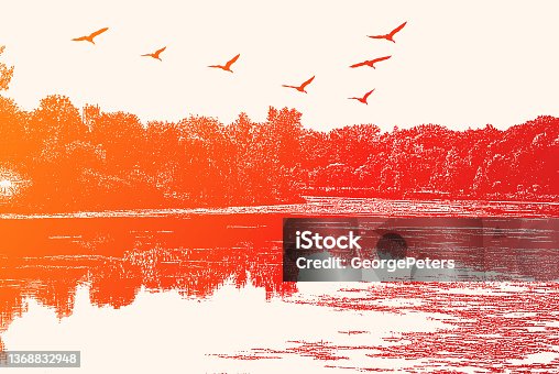 istock Lake with geese flying in V-Formation 1368832948
