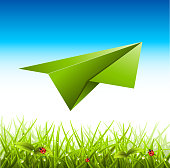 Vector illustration of meadow with paper airplane.