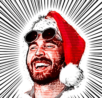 Laughing male hipster wearing Santa hat