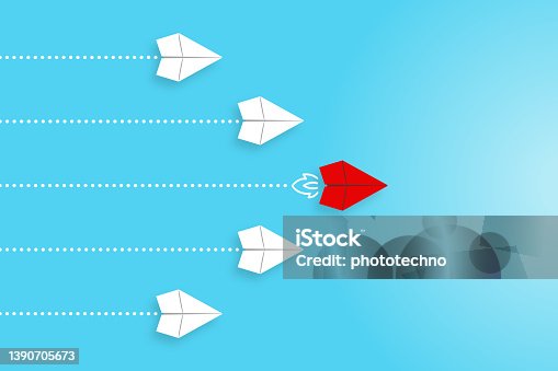 istock Leadership concepts with red paper airplane leading among white 1390705673