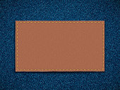 istock Leather label on denim. Blank template for copy space. 1318782062
