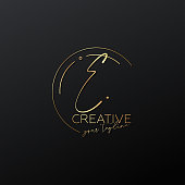 E letter calligraphy minimal monogram emblem style vector logo. Gold color and black background.