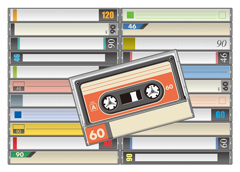 Lined up audio cassettes with a variety of colors and index cards