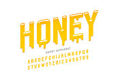 Liquid sweet honey font, alphabet letters and numbers vector illustration