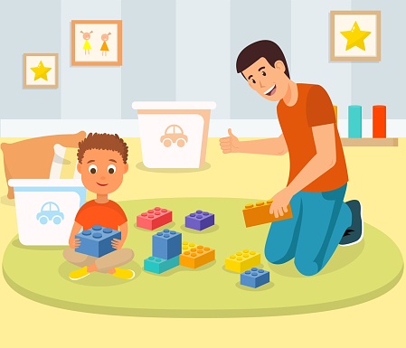 Little Boy Playing Building Blocks with Father