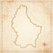 Map of Luxembourg in vintage style. Beautiful illustration of antique map on an old textured paper of sepia color. Old realistic parchment with a compass rose, lines indicating the different directions (North, South, East, West) and a frame used as scale of measurement. Vector Illustration (EPS10, well layered and grouped). Easy to edit, manipulate, resize or colorize. Please do not hesitate to contact me if you have any questions, or need to customise the illustration. http://www.istockphoto.com/portfolio/bgblue