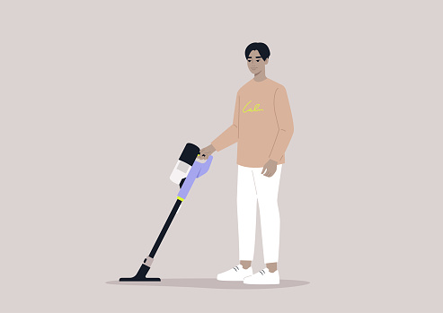 A male Asian character cleaning with a cordless vacuum cleaner, household chores