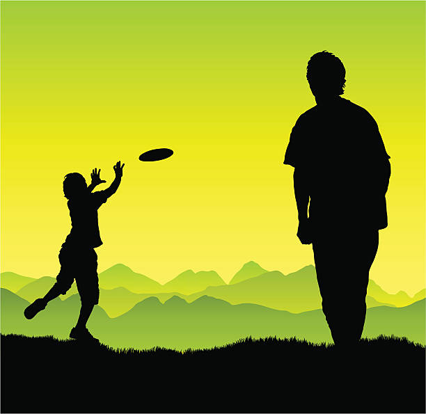 Man and boy play frisbee The two enjoy frisbee in the outdoors. Both are full silhouettes including feet. frisbee clipart stock illustrations