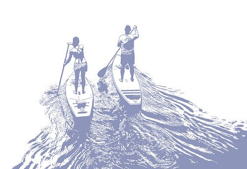 Man and woman paddleboarding