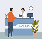 istock Man at the reception desk in the interior of the hospital. Vector flat style cartoon illustration. 1344935909