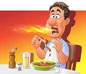 Vector illustration of man sweating and breathing fire while eating a hot and spicy meal. Perfect for a hot or spicy food illustration.