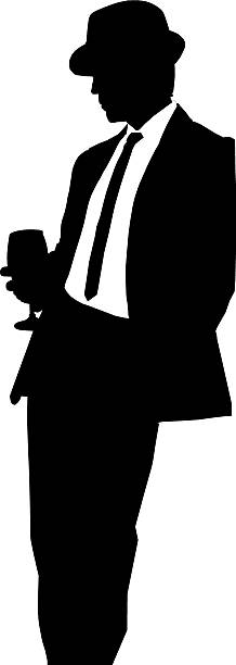 Man in hat with wine glass A silhouette of a man in a suit and hat leaning against a wall. stetner stock illustrations