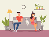 Man, woman and cat sitting on the sofa with notebook and smartphone. Vector flat illustration