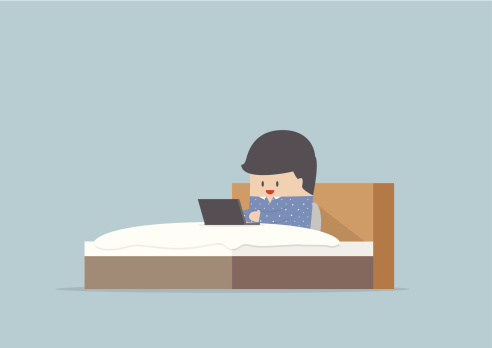 man-working-on-his-laptop-in-the-bed-vector-id506727137