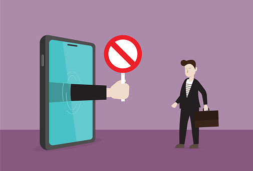 Manager show prohibition sign from mobile phone to businessman