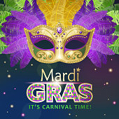 An invitation to the masquerade party for the Mardi Gras with feather carnival mask on the blue and purple colored background