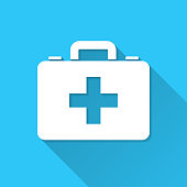 White icon of "Medical case - First aid kit" in a flat design style isolated on a blue background and with a long shadow effect. Vector Illustration (EPS10, well layered and grouped). Easy to edit, manipulate, resize or colorize. Vector and Jpeg file of different sizes.